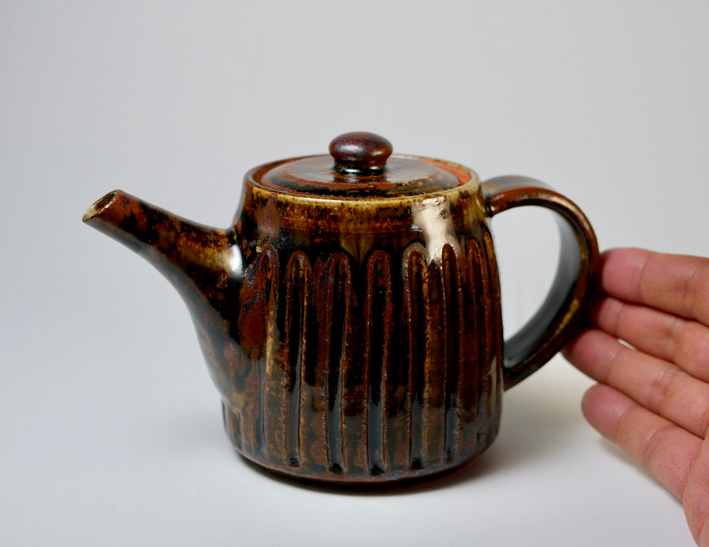 Iron-colored engraved teapot