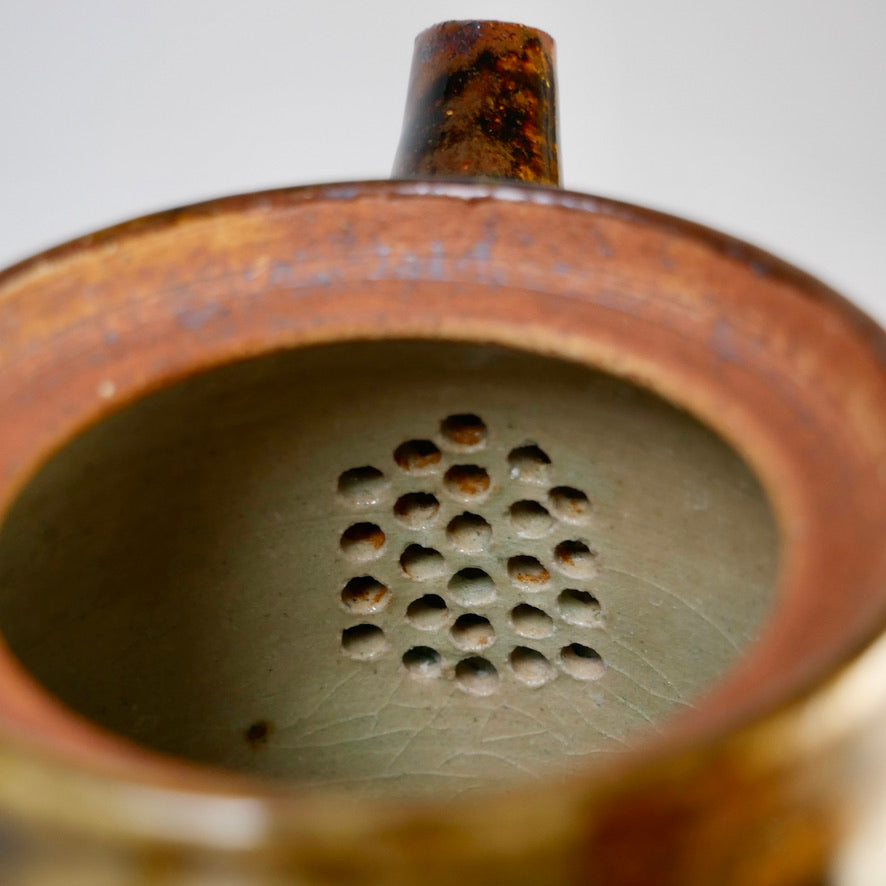 Iron-colored engraved teapot