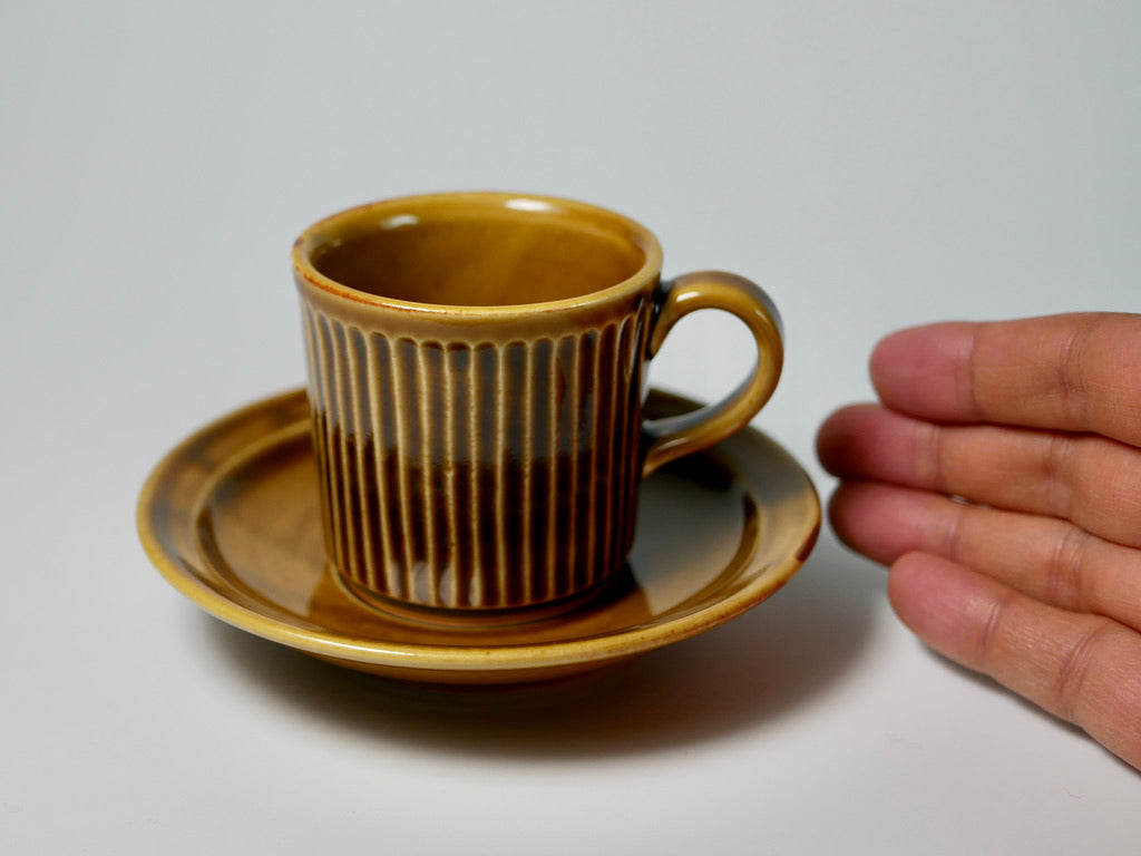 Ribbed yellow porcelain cup and saucer