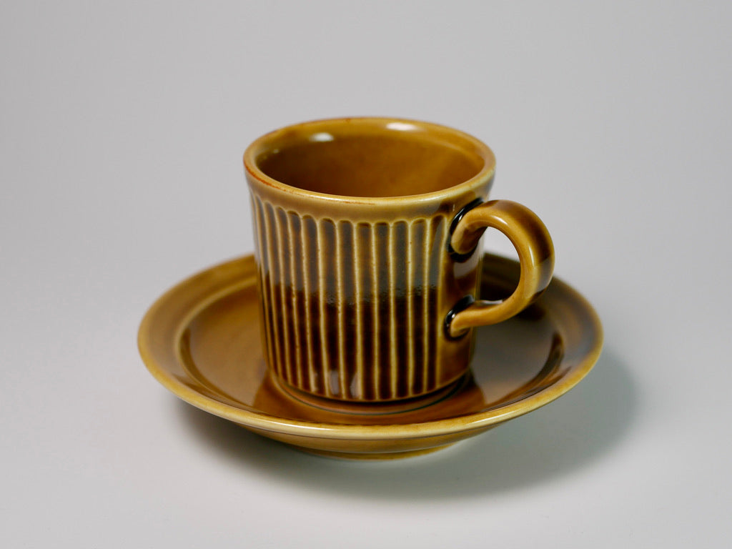 Ribbed yellow porcelain cup and saucer