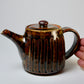 Iron-colored engraved teapot
