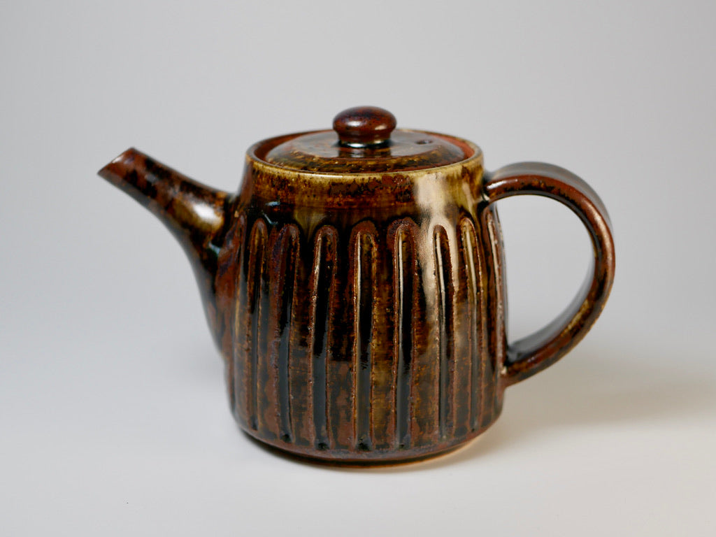Iron-colored engraved teapot