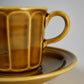 Chamfered yellow porcelain cup and saucer