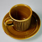 Ribbed yellow porcelain cup and saucer